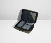 Four Insider Packing Cubes shown inside The Bigger Carry-On