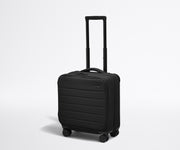 Angled product view of The Softside Compact Carry-On suitcase in Jet Black with raised handle
