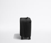 Side product view of The Softside Compast Carry-On suitcase in Jet Black shown fully expanded