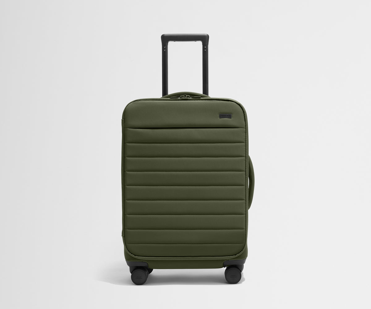 Front product view of The Softside Bigger Carry-On suitcase in Olive Green with raised handle