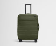 Front product view of The Softside Medium suitcase in Olive Green with raised handle