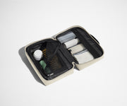 Small Toiletry Bag packed with a comb, skincare, and other travel-sized toiletries