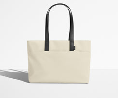 Front view of The Everywhere Tote with its leather handles up