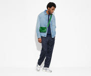 Person wearing The Mini Crossbody in Translucent Green