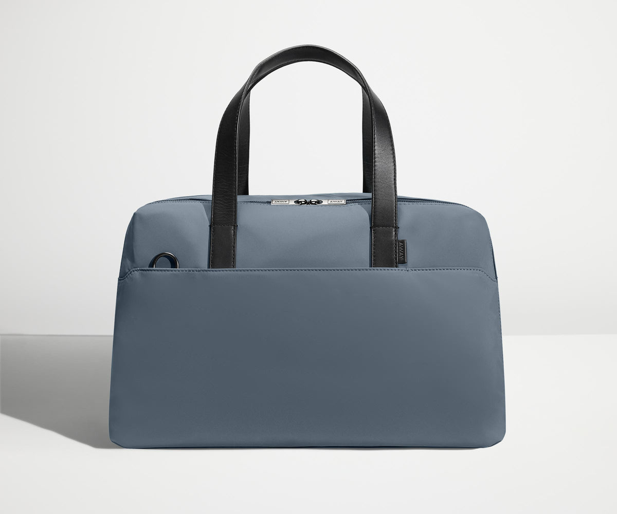 Front view of The Overnight Bag with leather straps up