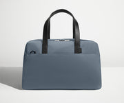 Front view of The Overnight Bag with leather straps up