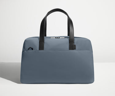 Front view of The Overnight Bag with leather straps up