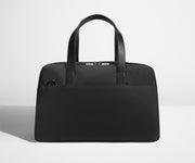 Front view of The Overnight Bag with leather straps up
