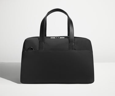 Front view of The Overnight Bag with leather straps up