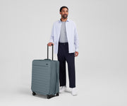 Person standing next to the Softside Large for scale