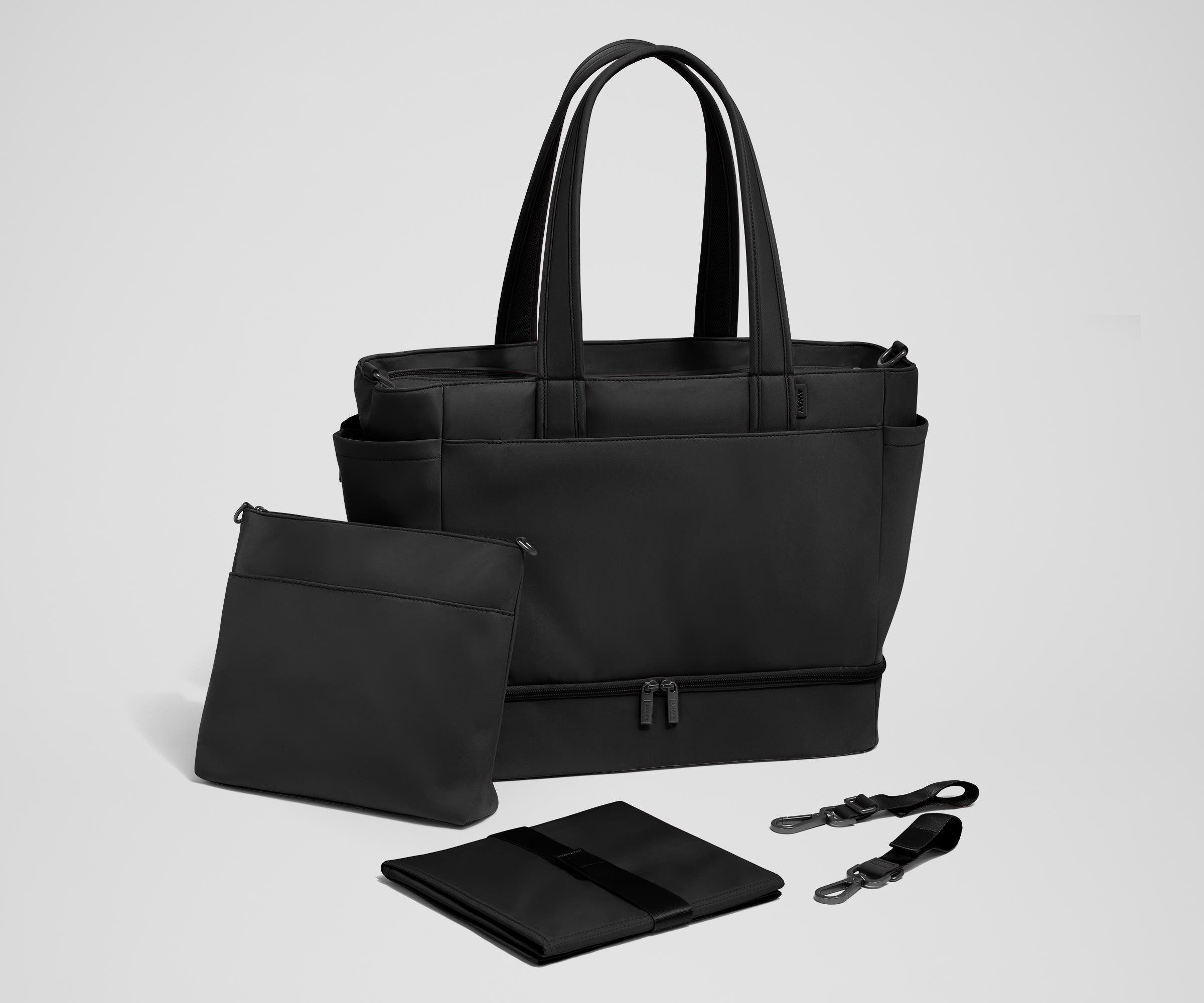 Tote with the included stroller clips, carry-all pouch, and changing pad