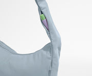 Chapstick in the discreet, zippered strap pocket