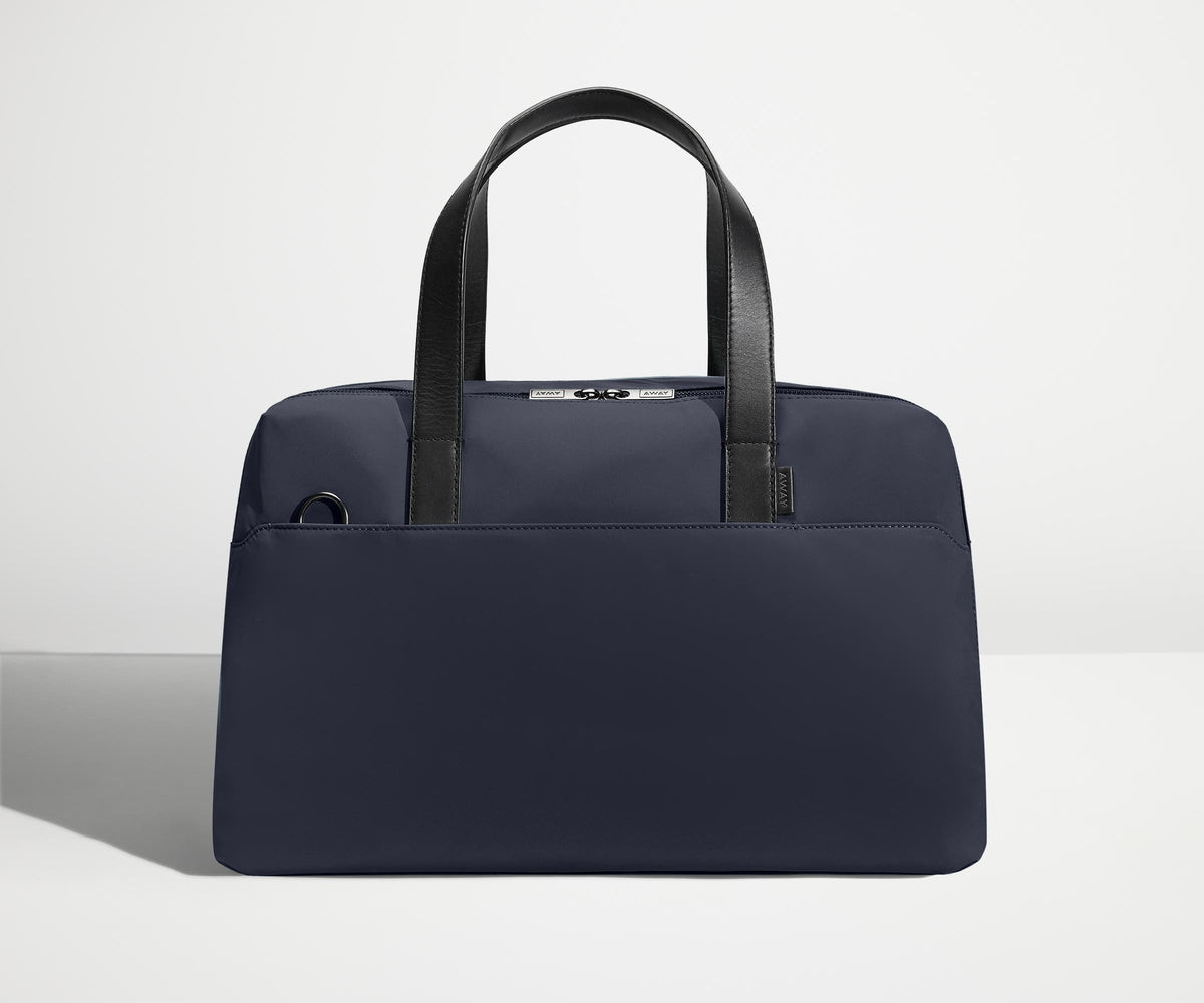 Front view of The Overnight Bag with leather straps up