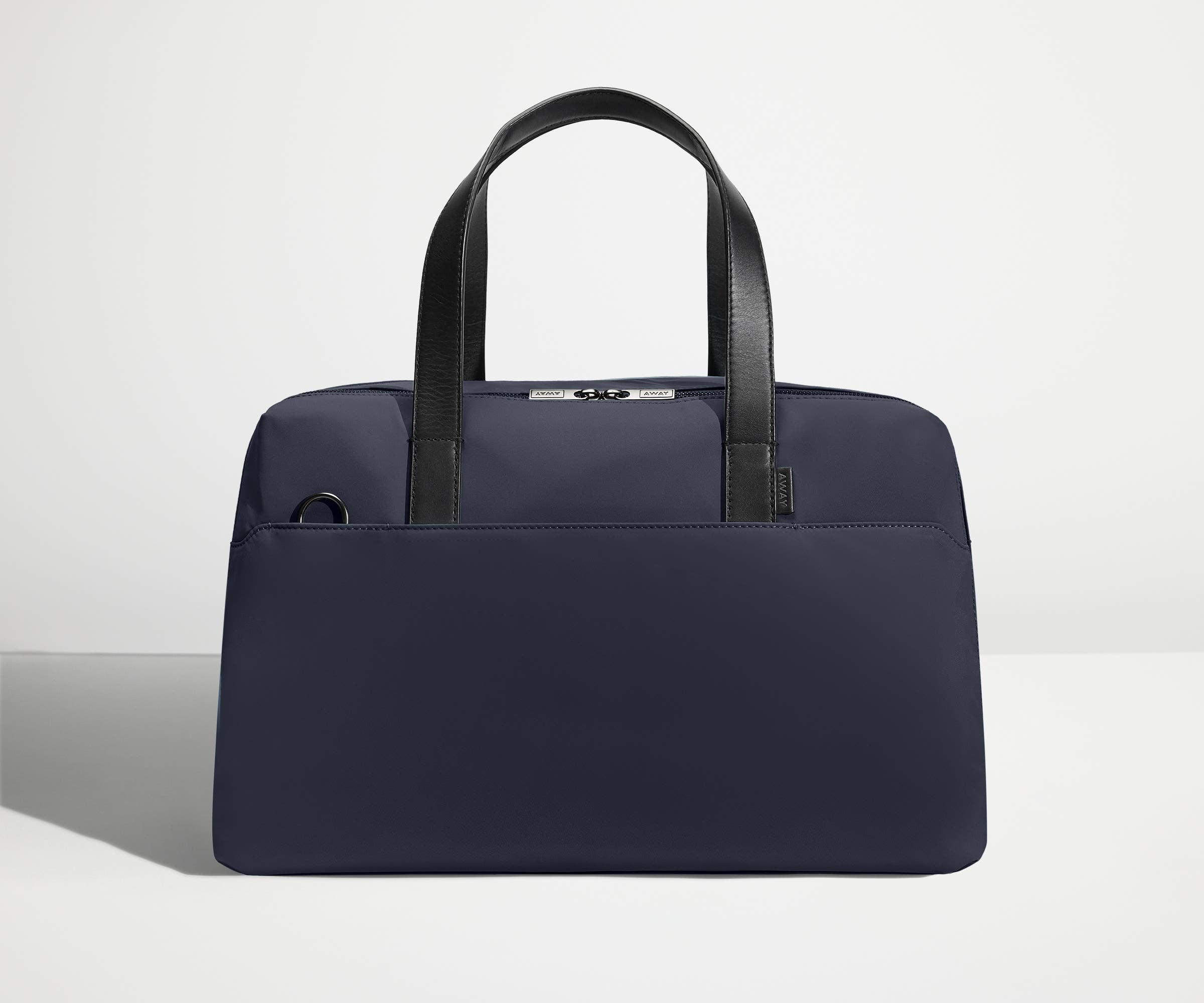 Front view of The Overnight Bag with leather straps up
