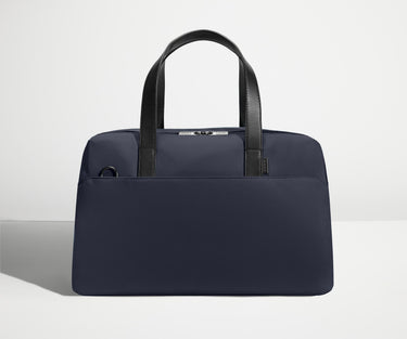 Front view of The Overnight Bag with leather straps up