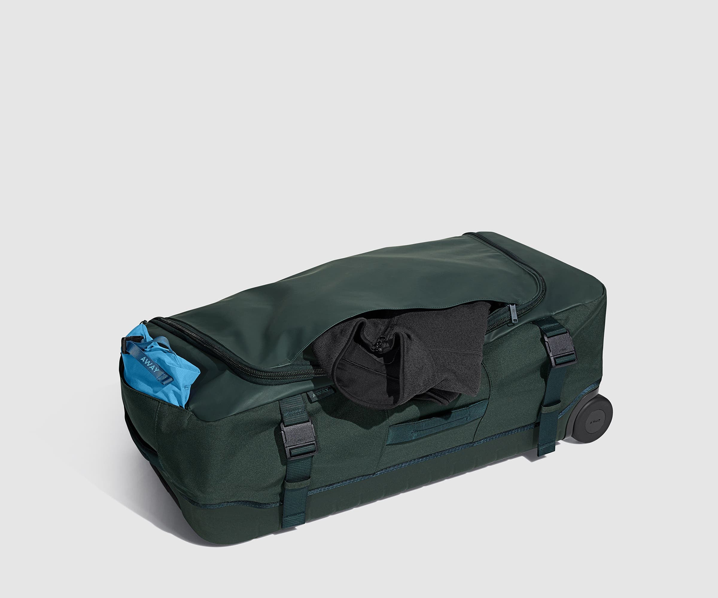 A lightweight jacket in the hidden front pocket and a pouch in an exterior slip pocket