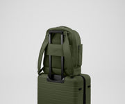 Double Diaper Backpack on top of an Away suitcase by the trolley sleeve