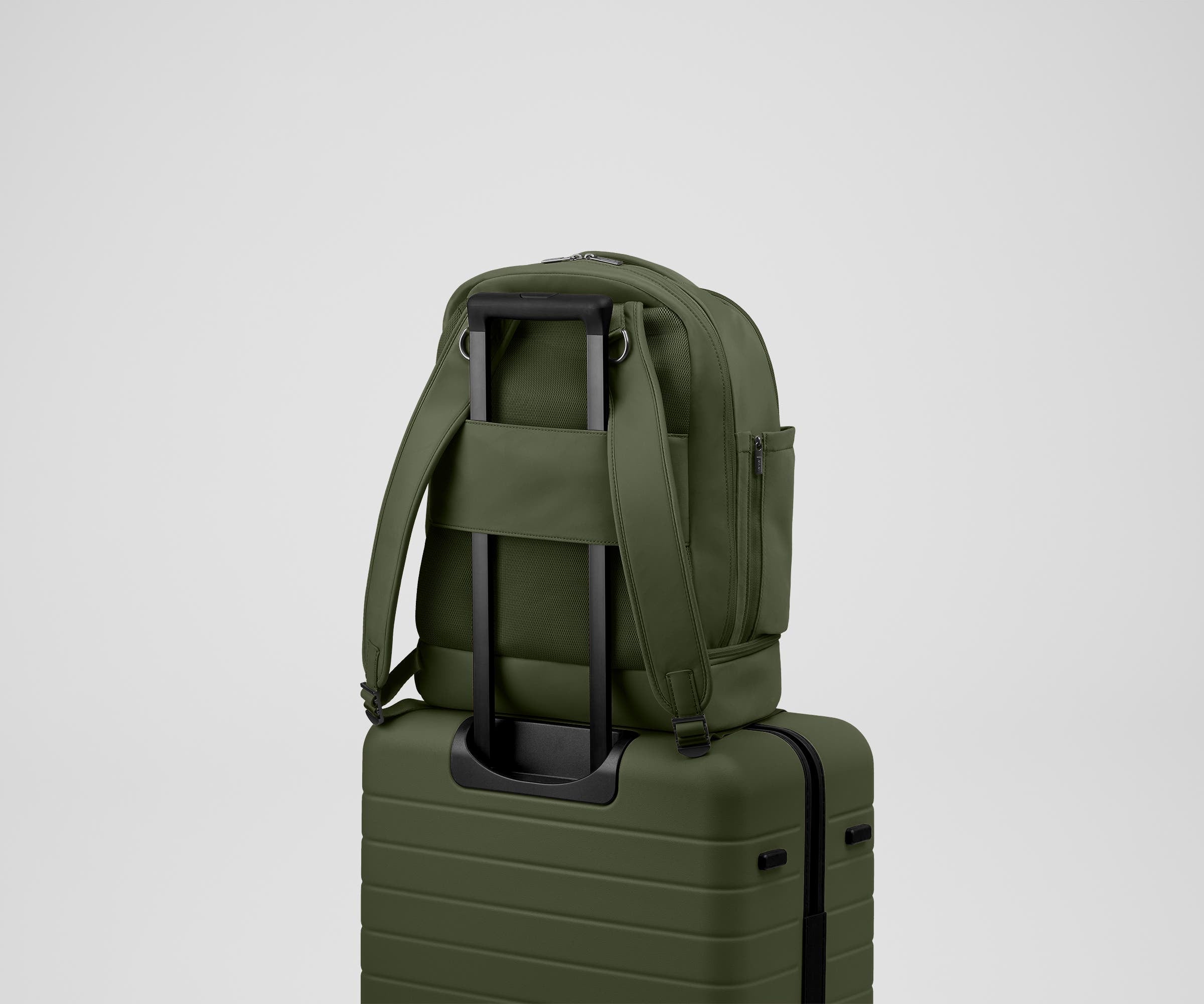Double Diaper Backpack on top of an Away suitcase by the trolley sleeve