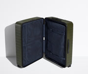 The Large suitcase in Olive Green shown open in an upright position to show interior organization and compression system