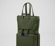 Double Diaper Tote on top of an Away suitcase by the trolley sleeve
