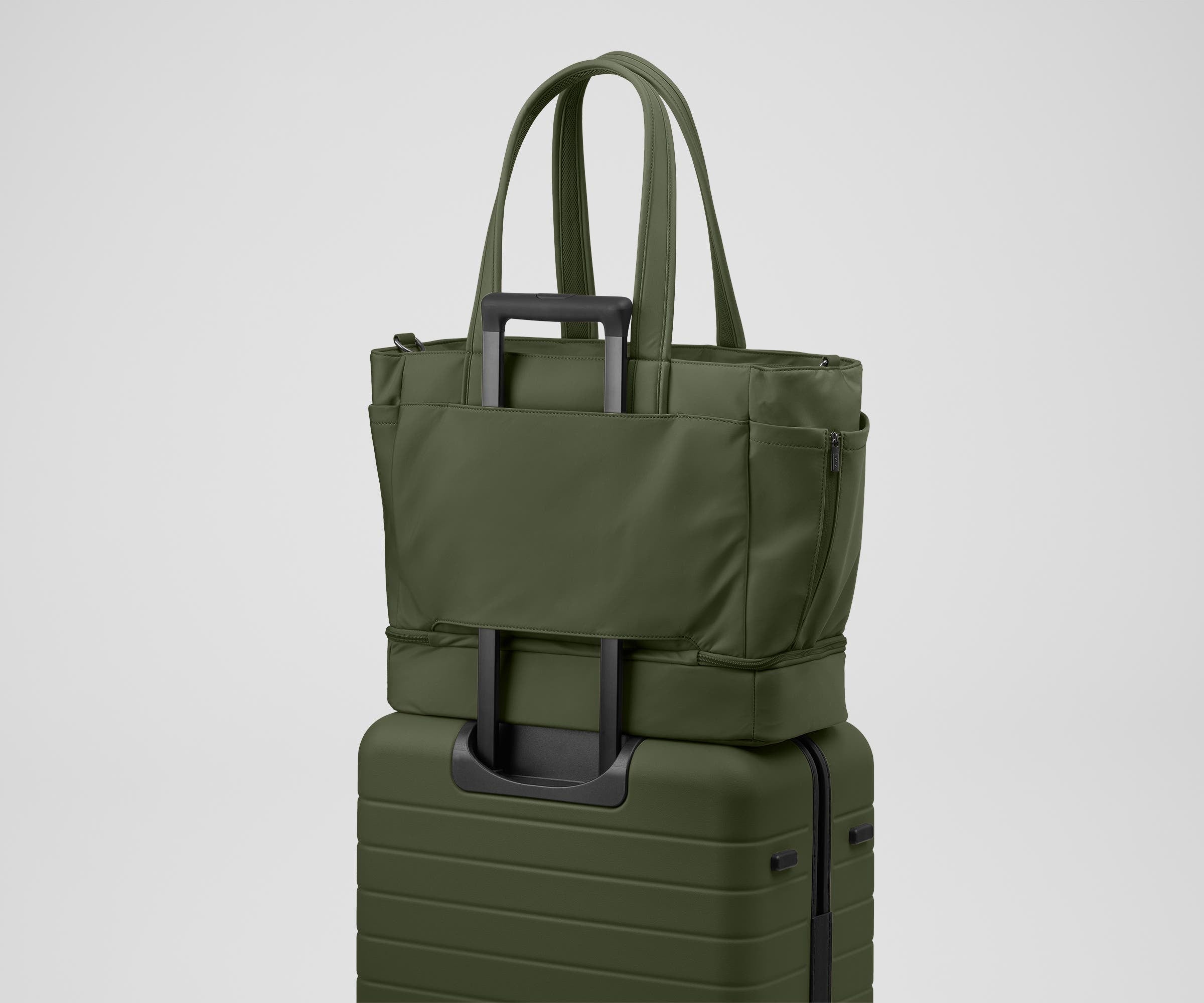 Double Diaper Tote on top of an Away suitcase by the trolley sleeve