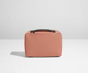 Small Toiletry Bag packed with a comb, skincare, and other travel-sized toiletries