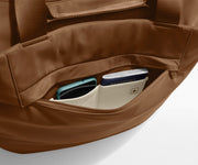 Phone and passport packed in an exterior zip pocket