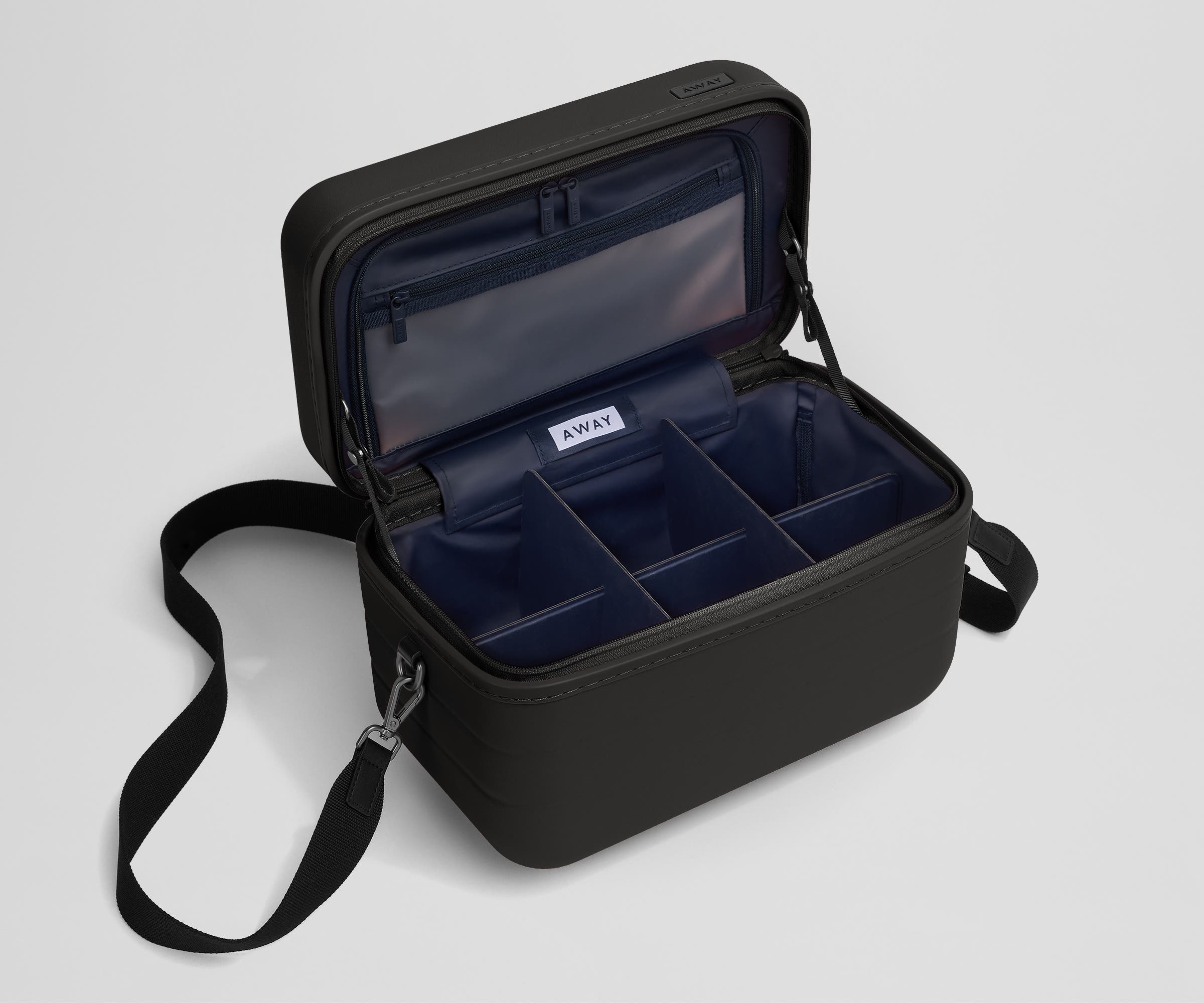 Removable fabric dividers in an empty Train Case