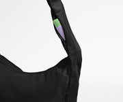 Chapstick in the discreet, zippered strap pocket