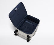 Open, unpacked Softside Bigger Carry-On, showing the depth of the bag and signature compression pad feature