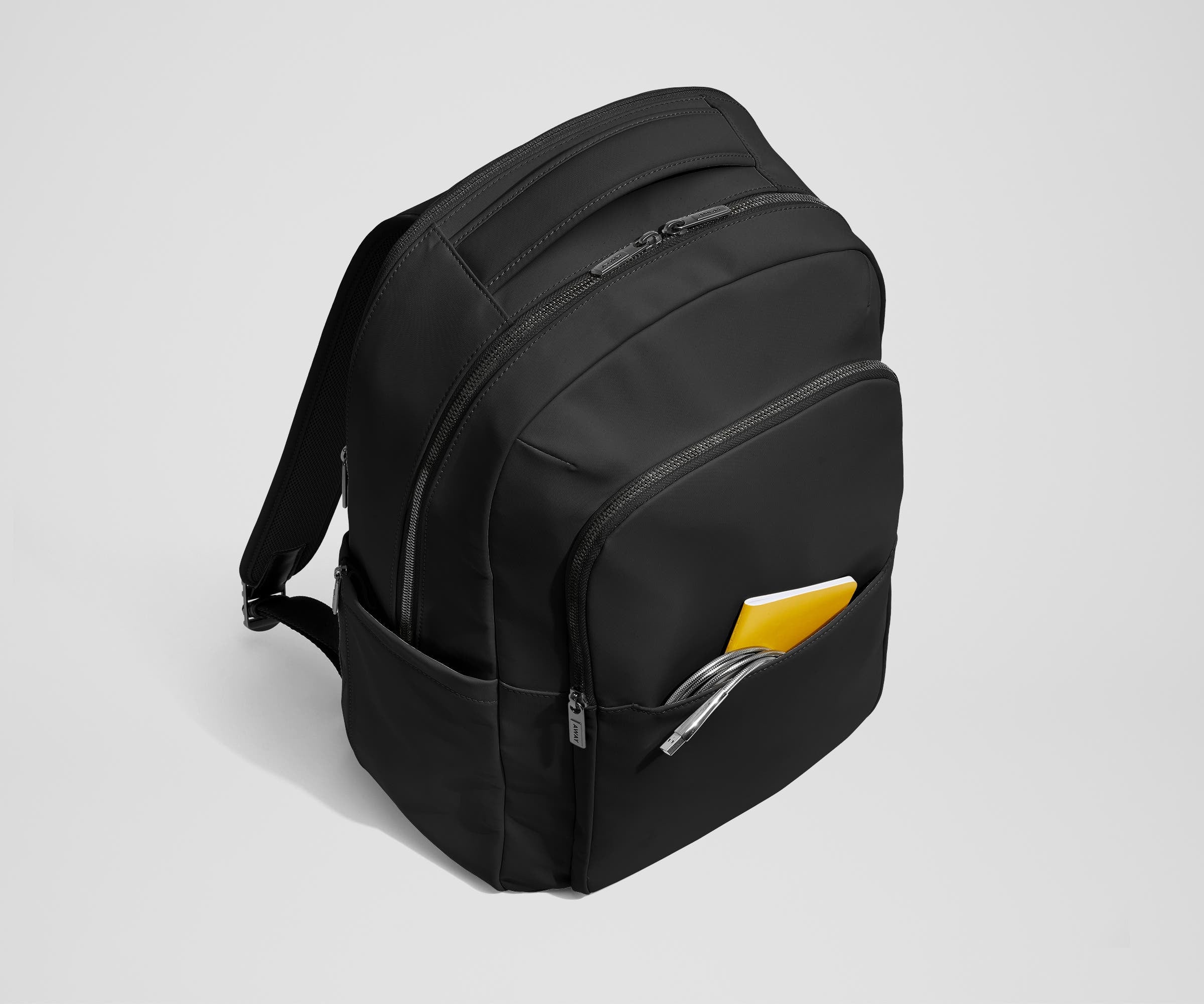 Front slip pocket with small notebook and charging cord