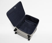 Open, unpacked Softside Large suitcase, showing the depth of the bag and signature compression pad feature