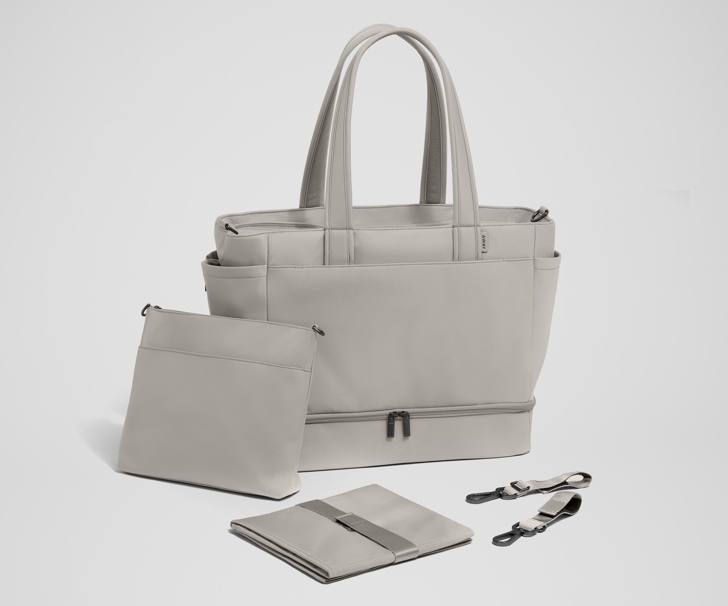 Tote with the included stroller clips, carry-all pouch, and changing pad