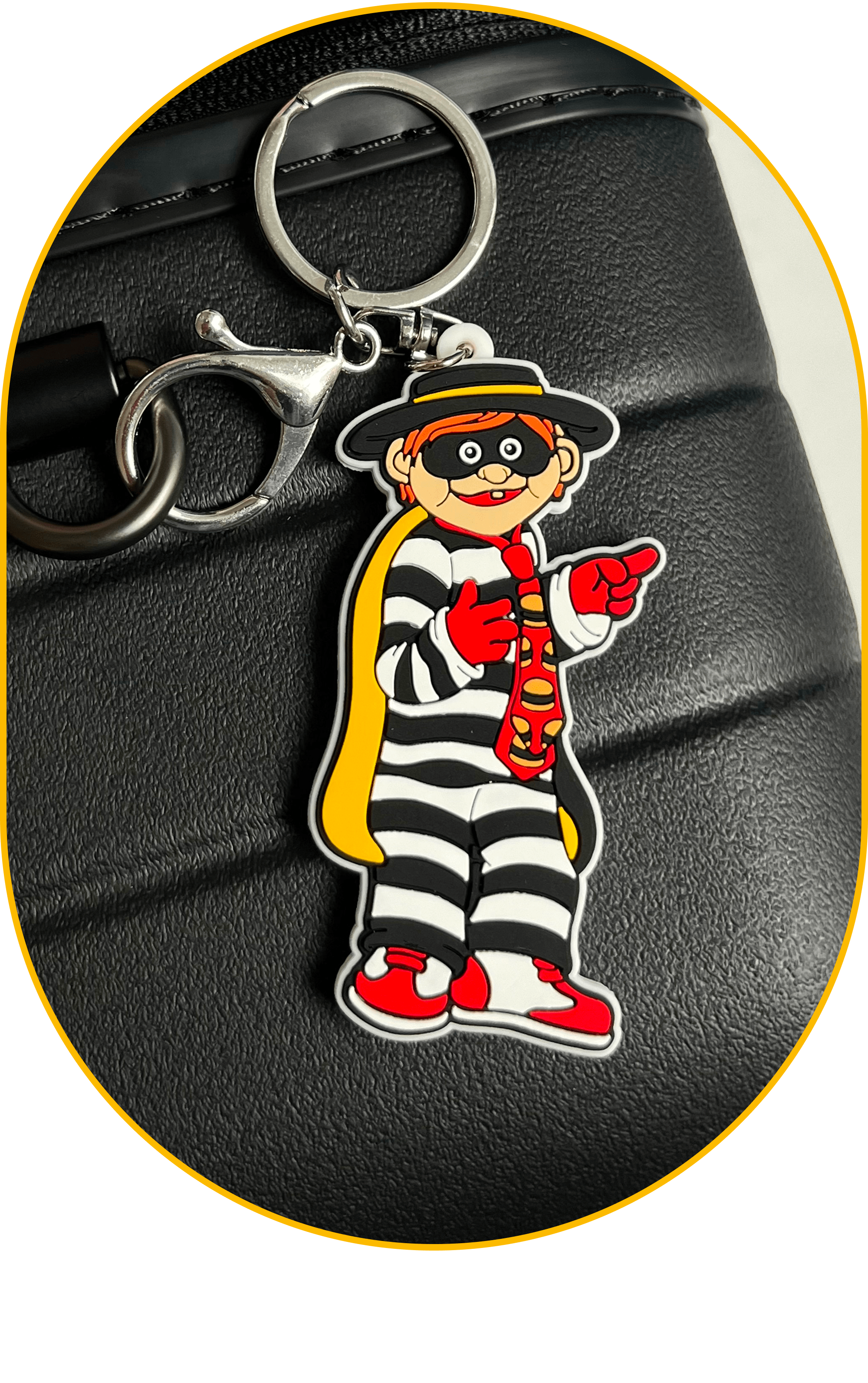 A Hamburglar luggage charm: Definitely smuggling sauce through TSA.